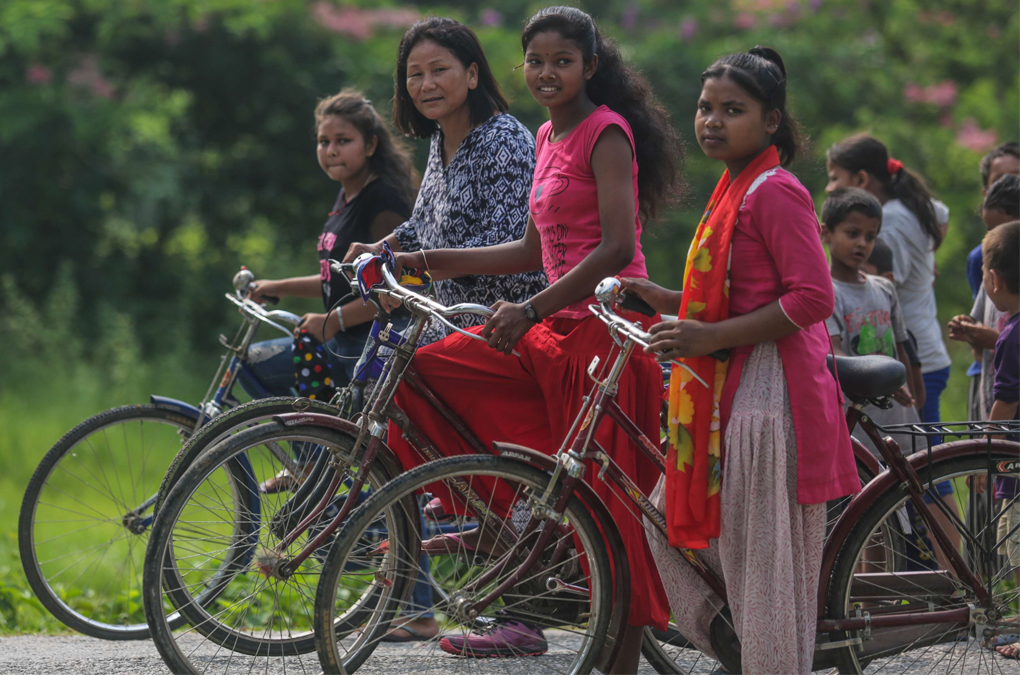 Indira Ranagamar Cycling with her Girls